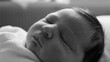 © Marco - Black and white close-up of a newborn baby sleeping peacefully, highlighting the delicate features and soft textures. Capturing themes of purity, tranquility, and timeless beauty.