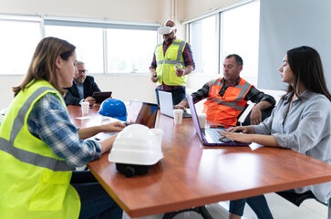 Engineer team employee plan meeting with virtual realty. Plant staff worker safety technician group planning process with virtual reality.