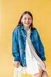© Melissa Milis Photography/Stocksy - Carefree tween girl portrait smiling and looking at camera