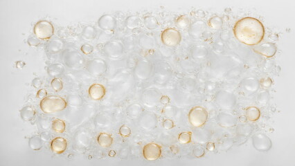 Poster - Oil droplets in water forming a captivating pattern. Droplets are varying sizes and look transparent against a white background