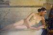 © Iuliia Versta/Stocksy - young sensual woman lying on a bath