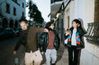 © Mal de Ojo Studio/Stocksy - Friends Laughing and Walking in Town