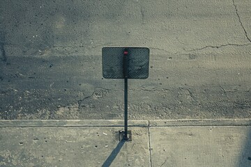 Aufkleber - A street sign on a concrete wall, providing information and guidance