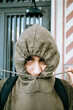 © Mal de Ojo Studio/Stocksy - Hooded Person Pulling Drawstring Tight