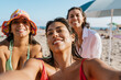 © Mal de Ojo Studio/Stocksy - Friends Taking Beach Selfie