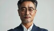 © fourtakig - Confident Asian Businessman Exuding Authority and Leadership on White Background
