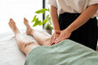 © Álvaro Lavín/Stocksy - Manual lymphatic drainage in legs.