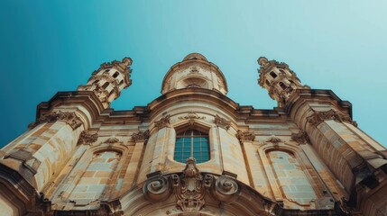 Wall Mural - Discover the architectural symmetry of a historic castle against a clear blue sky