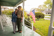 © Raymond Forbes LLC/Stocksy - Senior Citizen military  Veteran Portrait at home porch with wife