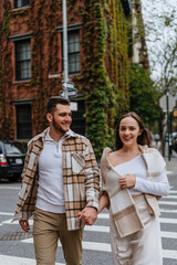 A couple dances gracefully on a city crosswalk, expressing love and joy