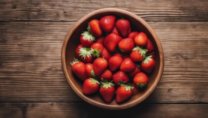 Wall Mural - Top view of strawberry on a wooden bowl