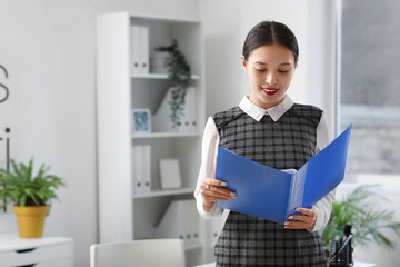 Sticker - Portrait of Asian businesswoman with folder in office