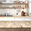 © mindstorm - Blurred kitchen background with focus on an empty wooden table, perfect for product display