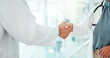 © peopleimages.com - Doctors, welcome and shaking hands for healthcare, meeting and clinical research with hello, consultation or advice. Medical people with handshake for introduction, success or research collaboration