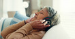 © peopleimages.com - Retirement, senior woman and sofa with headphones, relax and calm in living room, streaming music and audio. Rest, happy and mature lady with headset for podcast, radio and carefree on couch