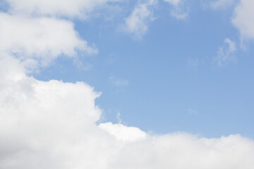 Blue sky and white puffy clouds.