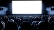 © Atchariya63 - A large, empty screen in a darkened movie theater, with a crowd of people eagerly awaiting the show.