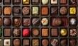 © Nadin Faust - high-resolution photo of assorted chocolates in various shapes and colors, arranged in neat rows with space between each, highlighting unique textures and appearances