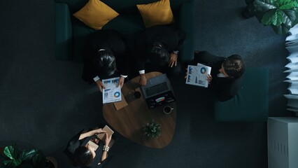 Wall Mural - Top down aerial view of professional business man handed out business document to investor while manager placed tablet display financial statistic graph on table and listen presentation. Directorate.