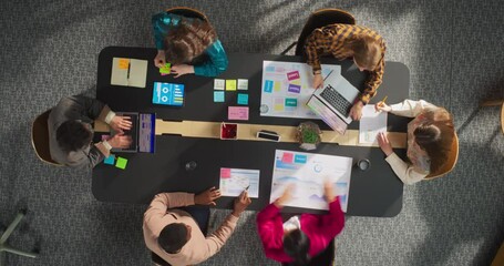 Aufkleber - In the Startup Meeting Room: Team of Entrepreneurs Sitting at the Conference Table, Discussing Business, Solving Problems, Using Tablet, Laptop, Sharing Documents. Top Down View Time Lapse Shot.