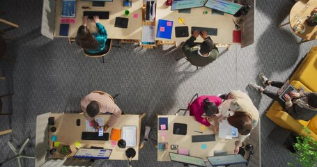 Leinwandbilder - Top Down View: Diverse Team of Professionals Working on Digital Marketing Projects. Businesspeople Analyze Data, Discuss Strategies, and Use Desktop Computers in An Office. Creative Workspace Concept.