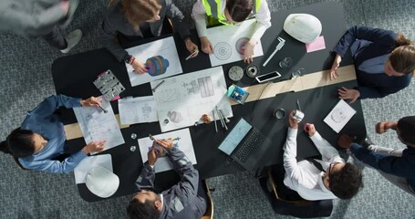 Aufkleber - Zoom Out Top Down View: Diverse Team of Business Managers and Construction Engineers Working With Blueprints Of Heavy Industrial Machinery in An Office. Teamwork Of Colleagues With Laptop, Tablet