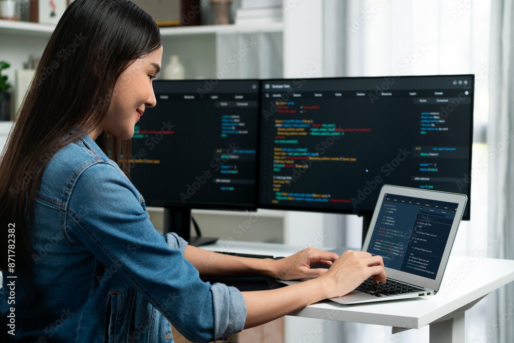 Smiling young Asian in IT developer creating with typing online ...
