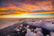 © AmazingAerialAgency - Aerial view of majestic mountain ridge at sunset with dramatic sky, Hawaii, United States.