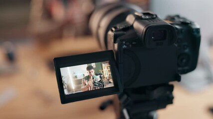 Poster - Camera, screen and review of influencer, digital and closeup of person in video, blogger and shooting. Home, talking and guide for vr headset, man and vlog for advice, live streaming and online