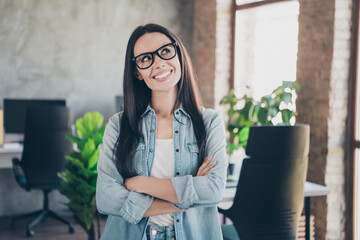 Wall Mural - Photo of attractive good mood lady agent dressed jeans shirt working arms crossed indoors workplace workstation loft