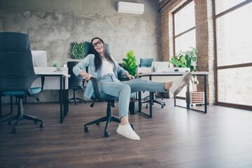 Wall Mural - Full body photo of attractive woman ride armchair dressed denim clothes executive business leader work comfort beautiful office interior