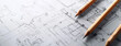 © Sudarshana - detailed closeup wide horizontal photo of yellow color drawing pencils on a architectural layout plan blueprint drawing on a table