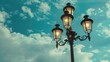 © 2rogan - Vintage street lantern against cloudy sky with three lamps on pole Blank space included