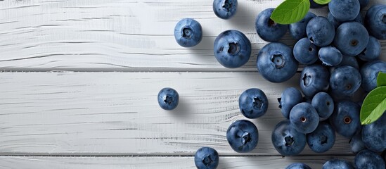 Poster - Blueberries on a white wooden surface, symbolizing healthy eating with antioxidants. Ideal for website or banner design with ample copy space image.