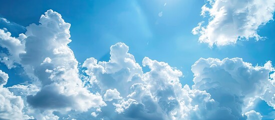 Poster - Blue sky with fluffy white clouds, perfect as a copy space image for adding text.