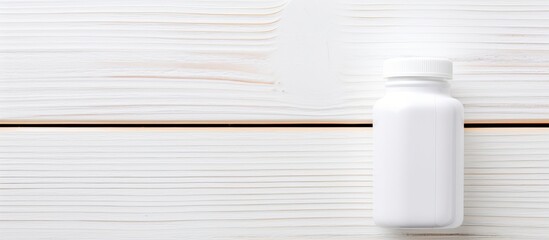 Aufkleber - White wooden background displaying a pill bottle with copy space image.