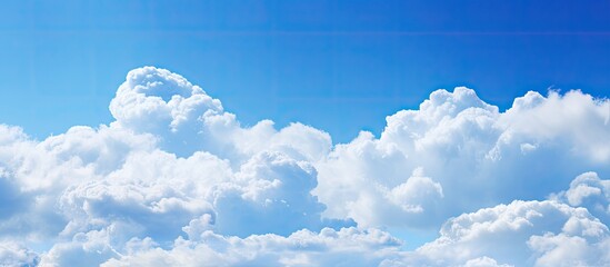 Poster - The blue sky transitioning with white clouds can be incorporated as the backdrop with copy space image.