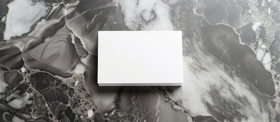 Aufkleber - Blank white business cards placed on a sophisticated gray marble backdrop with clipping path for customizing designs on the cards in a copy space image.