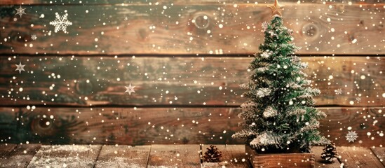 Poster - Festive Christmas fir tree set on a wooden backdrop scattered with delicate snowflakes, perfect for a copy space image.