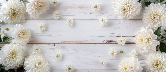 Aufkleber - Chrysanthemum flowers form an elegant frame on a white wooden backdrop, ideal for a copy space image.