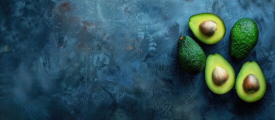 Poster - Close-up of avocados with copy space image on a dark studio background.
