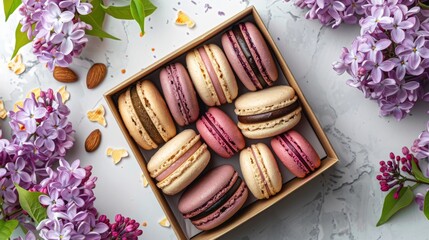 Wall Mural - Assorted French macarons in a gift box with lilac flowers top view