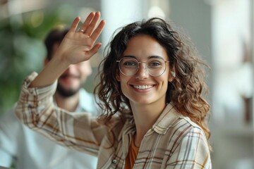 Wall Mural - woman in smart casual outfit and eyeglasses waving on globalcall webinar workshop: business meeting 