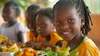 © RPL-Studio - Close up of happy African children eating fruit and vegetables in school, school meals