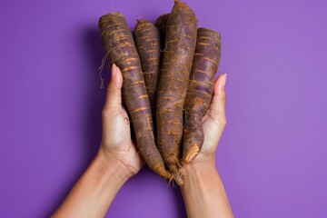 Poster - Fresh organic cassava on purple background