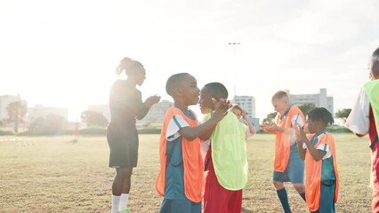 Wall Mural - Football, hands and coach with children for celebration, motivation and team spirit for sport competition. Soccer field, applause and trainer with players for win, achievement and confidence boost