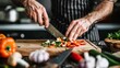 © Plaifah - A chef skillfully chopping fresh vegetables on a wooden cutting board