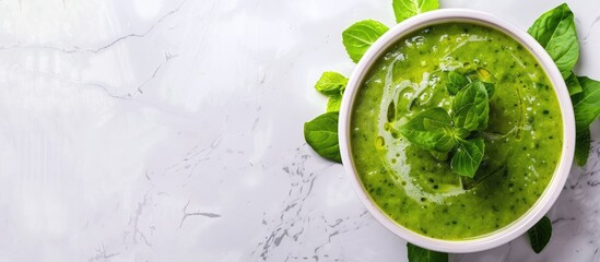 Sticker - A vibrant spring vegetable soup displayed on white marble with copy space, seen from above.