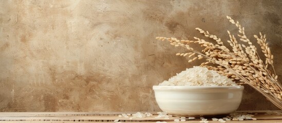 Poster - Rice plant and dried paddy rice in a white dish against a brown wooden background, providing ample copy space image.