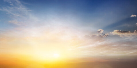 Wall Mural - sunset sky clouds in the evening with colorful orange, yellow, pink and red sunlight and dramatic st